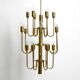 Three staged 18 arm Mid Century brass chandelier with a long brass rod