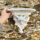Antique wall console in patinated white plaster.