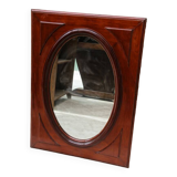 Oval mirror in beveled glass and solid mahogany