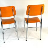 Pair of vintage orange leatherette chairs