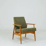 Mid-century modern design armchair in olive green corduroy.