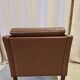 Fauteuil danois en cuir marron à dossier bas 1960