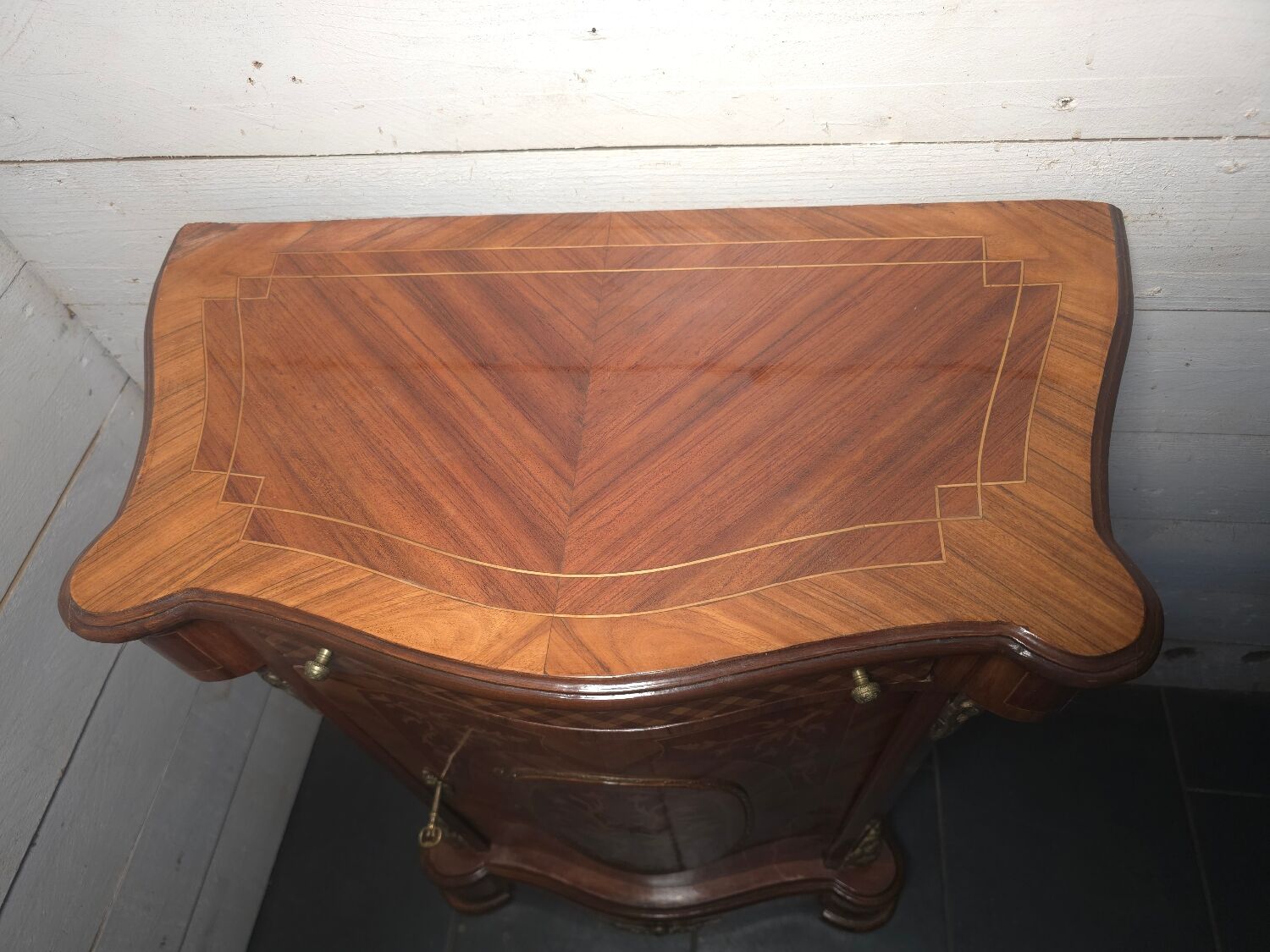 Small support table in Louis XV style with marquetry and bronze.