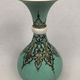 Ball vase with bent barrel in celadon green porcelain, nineteenth