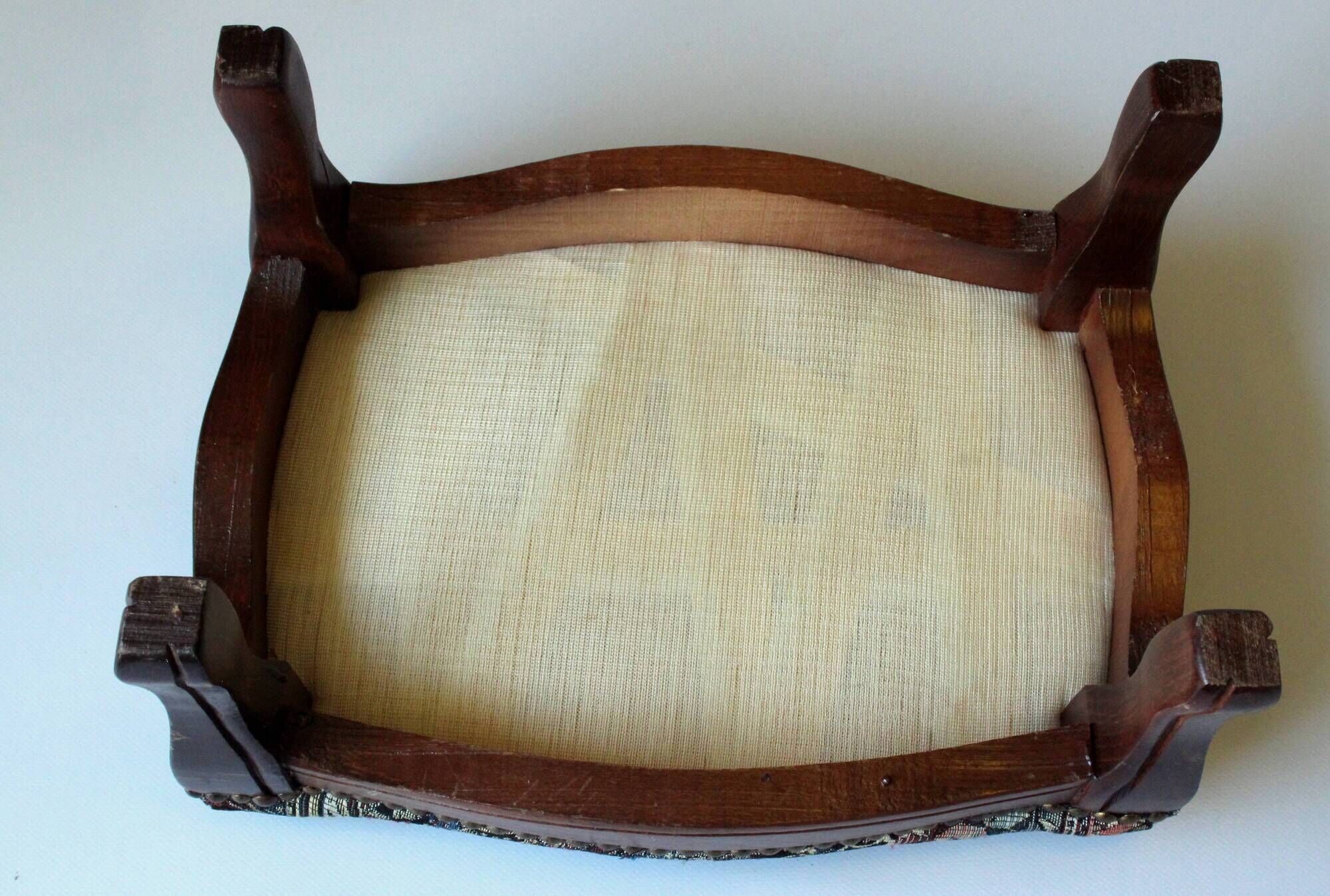 Small foot stool made of wood with upholstery, vintage from the 70s
