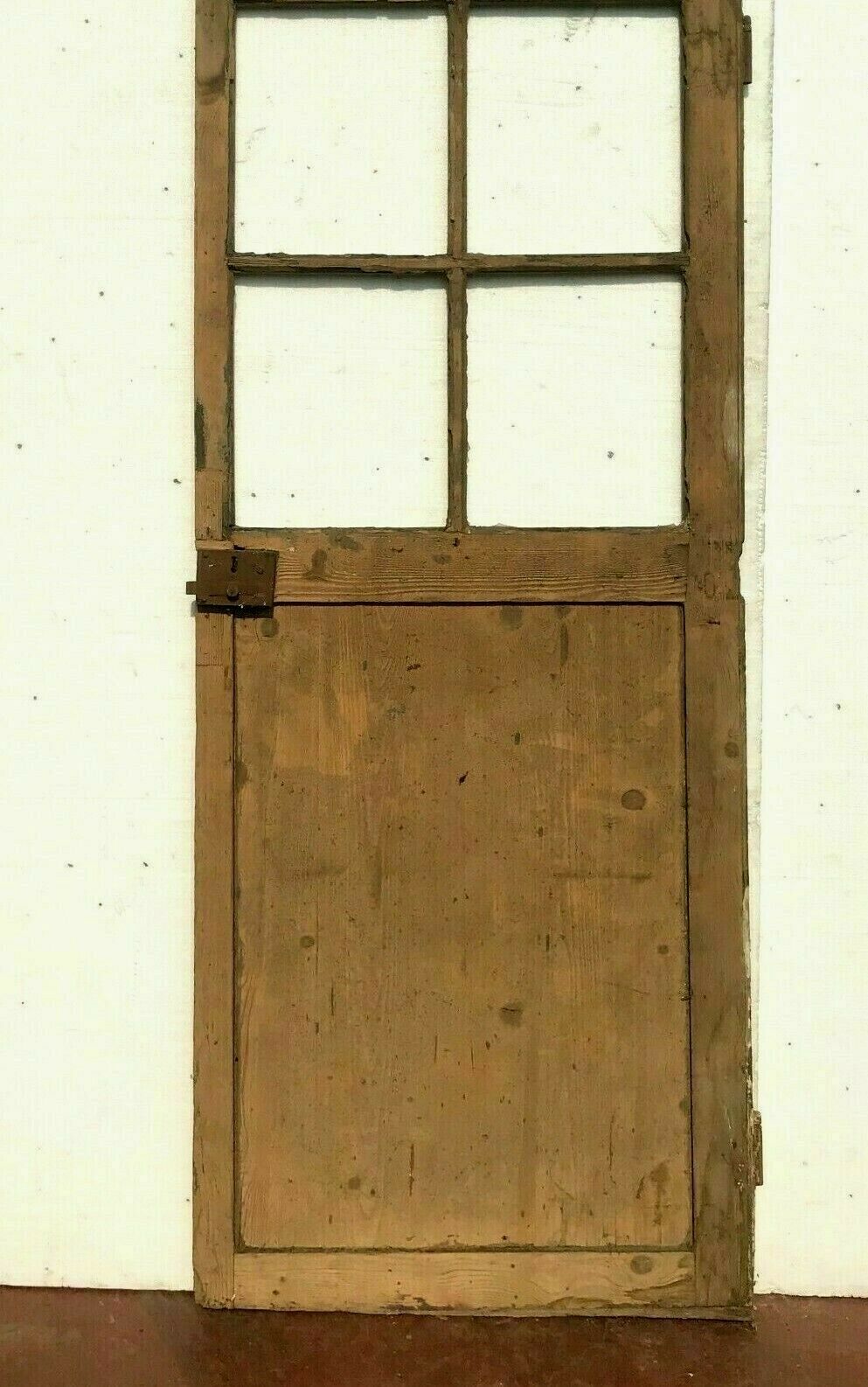 Elderly fir door with 20th century small tile