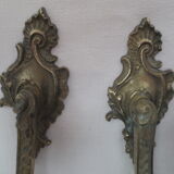 Pair of embraces in brass or bronze