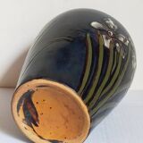 Old enameled earthenware vase with daffodils early 20th century