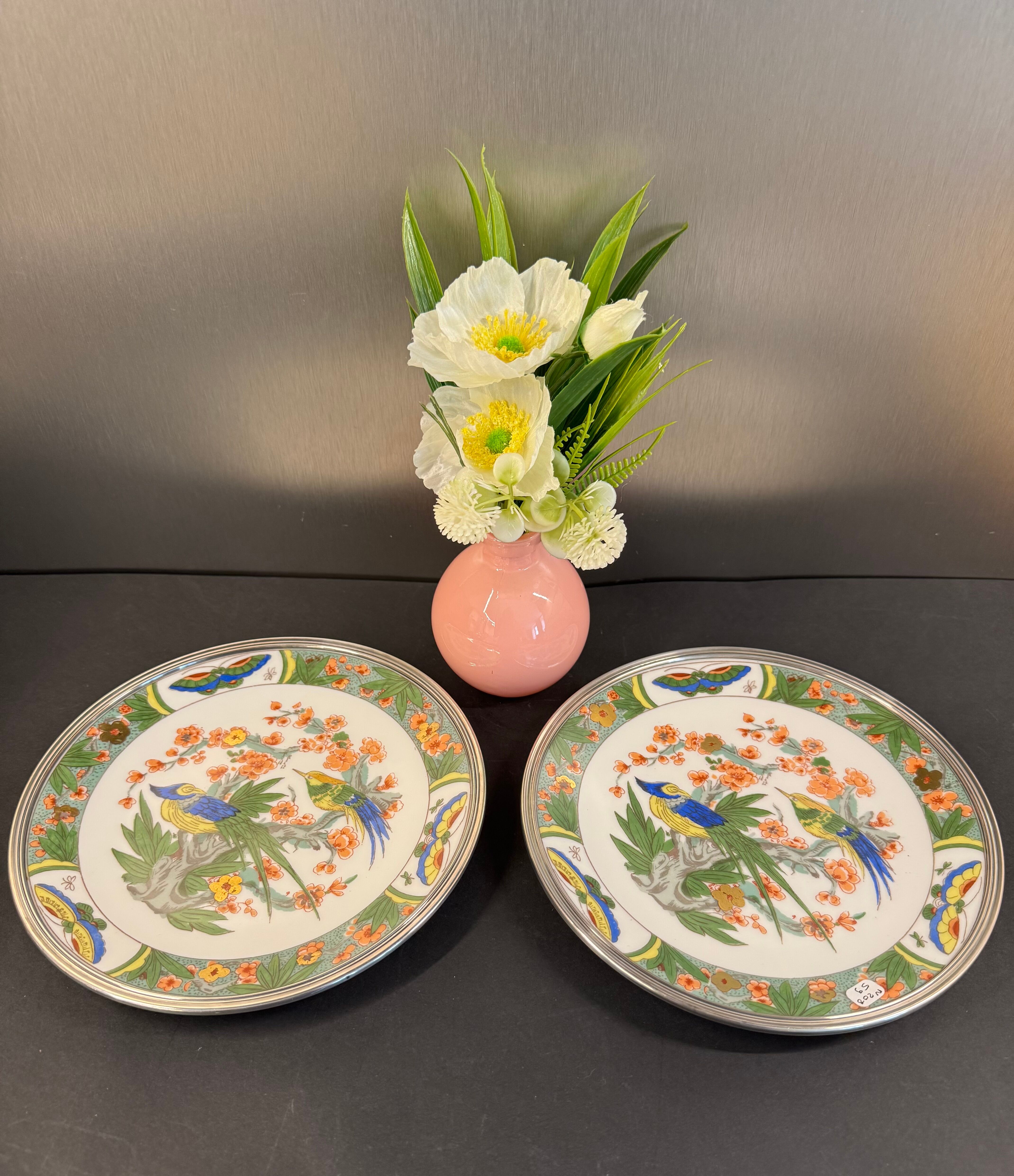 Two Raynaud Limoges plates and Tetard brothers silver.