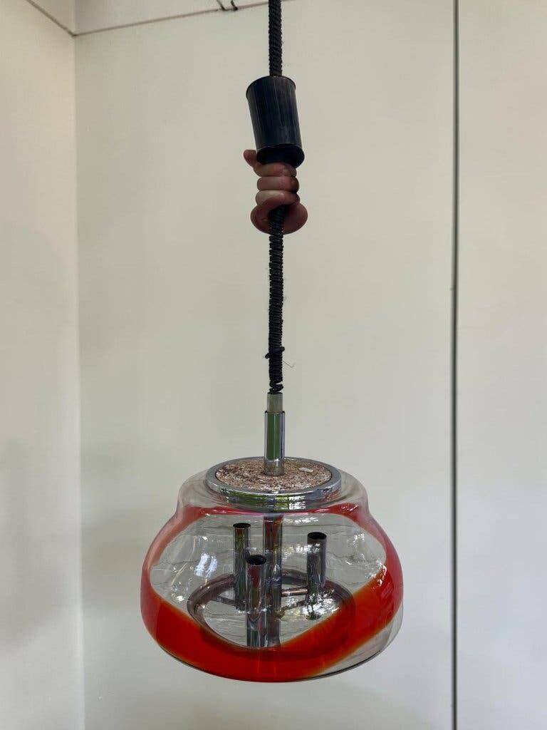 Vintage Murano glass pendant light with orange accent.