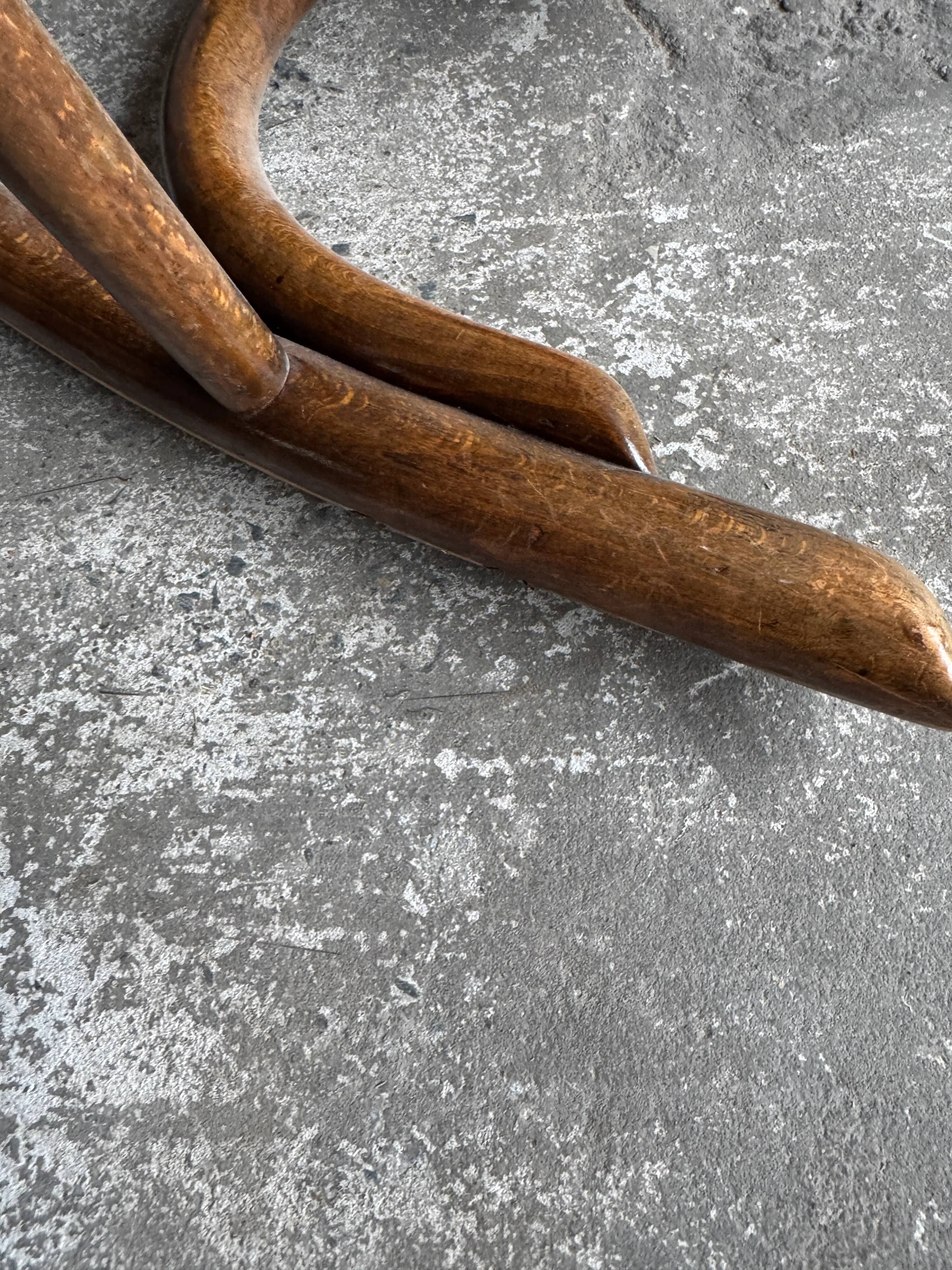 Warm walnut bentwood and cane child's rocking chair early 20th-century
