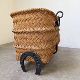 Magazine rack or log rack in straw with brutalist base from the 50s