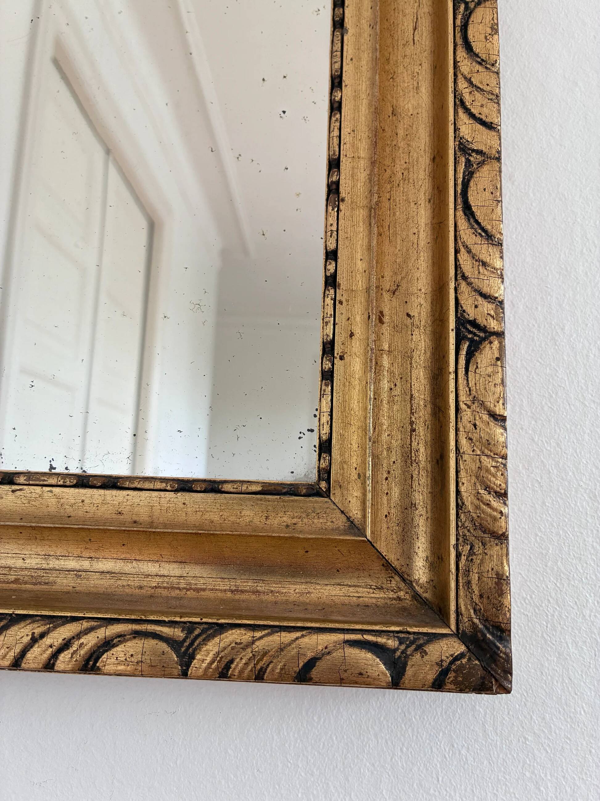 Antique French giltwood wall mirror in gold