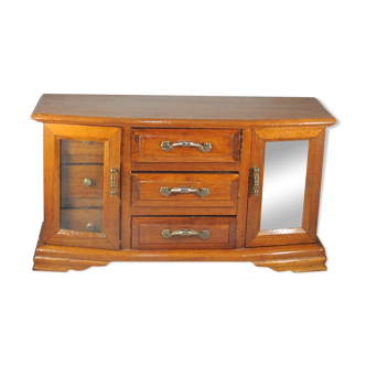 Wooden jewelry box in the shape of a chest of drawers
