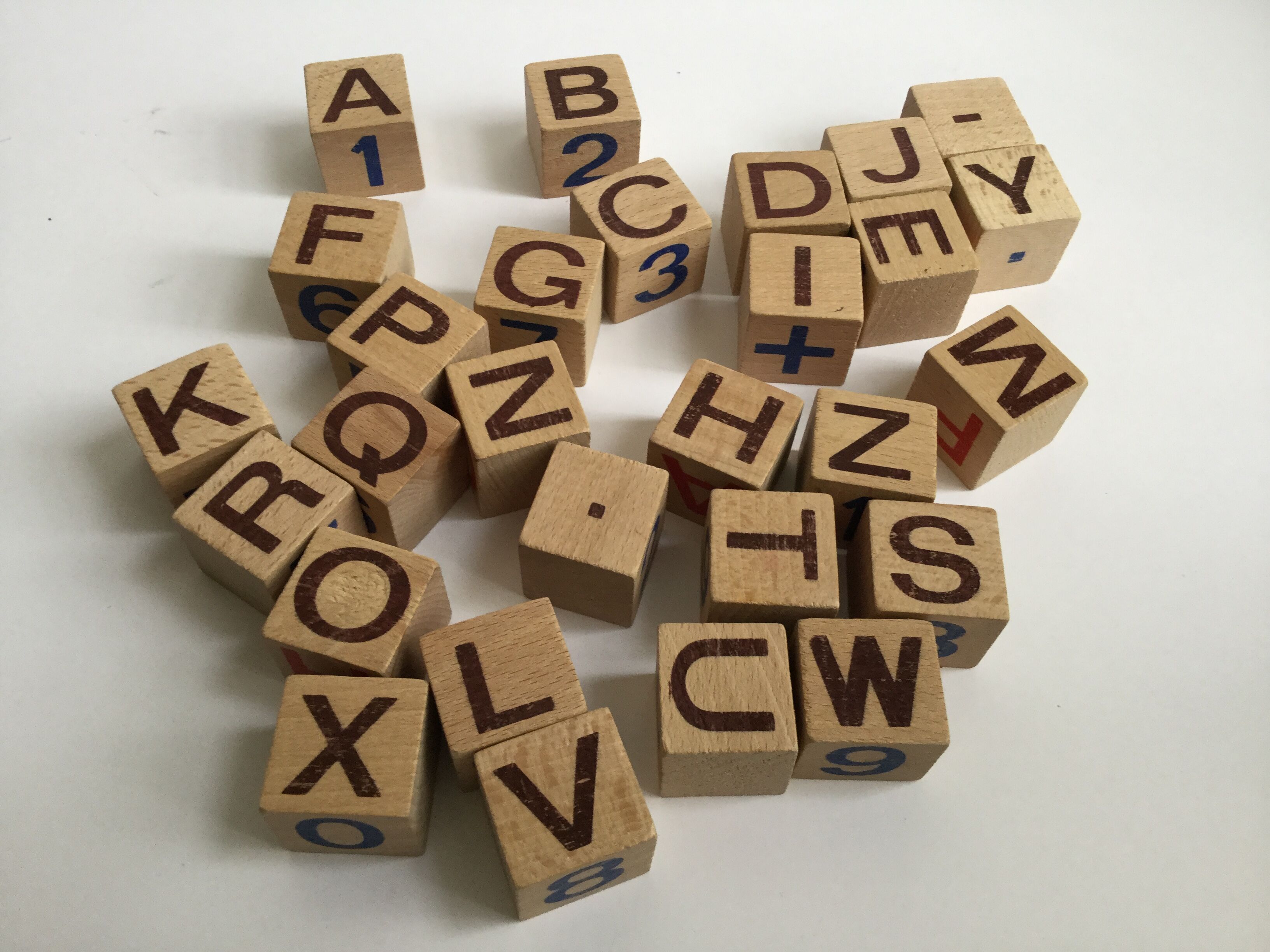 Ancient wooden toy cubes alphabet, figures and pictures