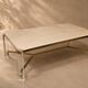 1970s dining table in travertine, gold metal and plexiglass.
