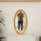 Miroir vintage ovale en bois doré années 60 77*41 cm