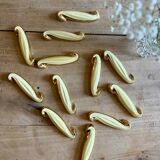 Set of 12 vintage art deco yellow and gold ceramic knife rests