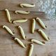 Set of 12 vintage art deco yellow and gold ceramic knife rests