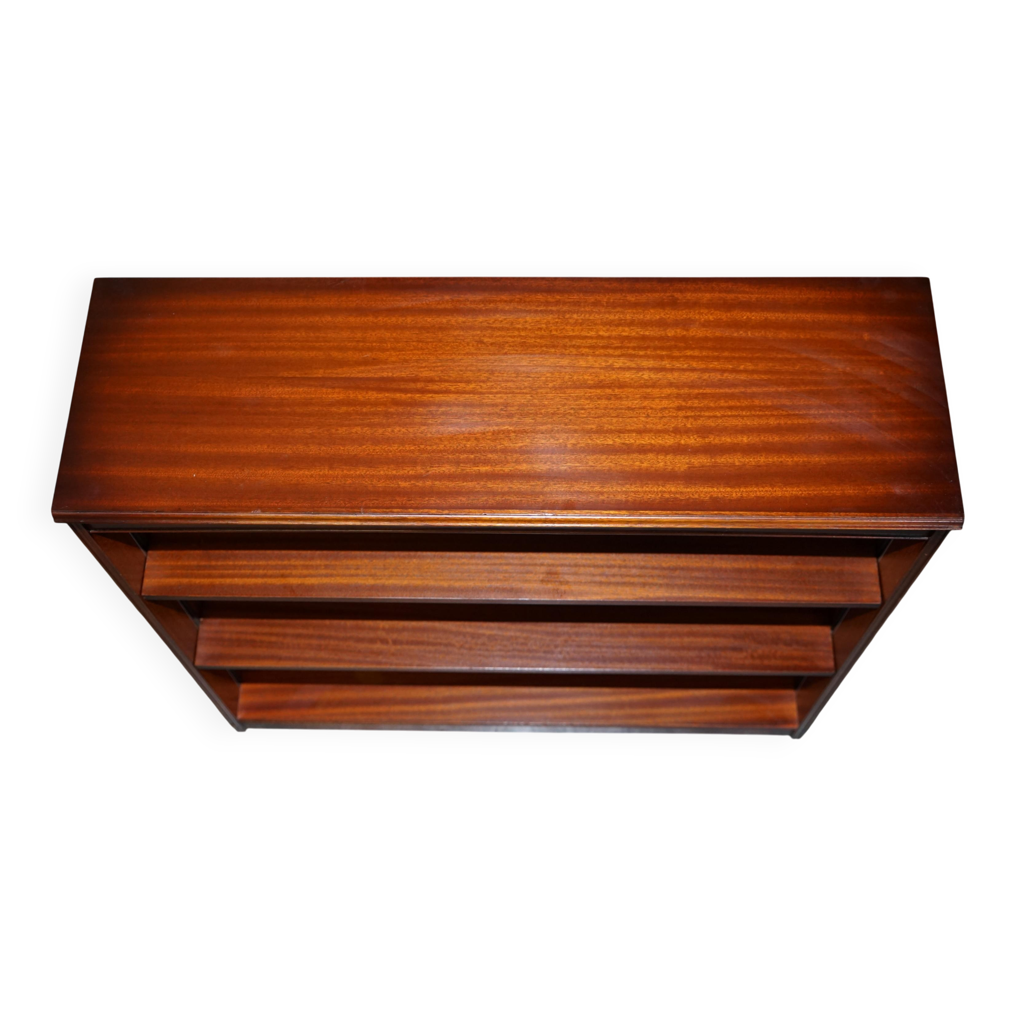 Pair of open dwarf bookshelves in mahogany by Shaws of London.