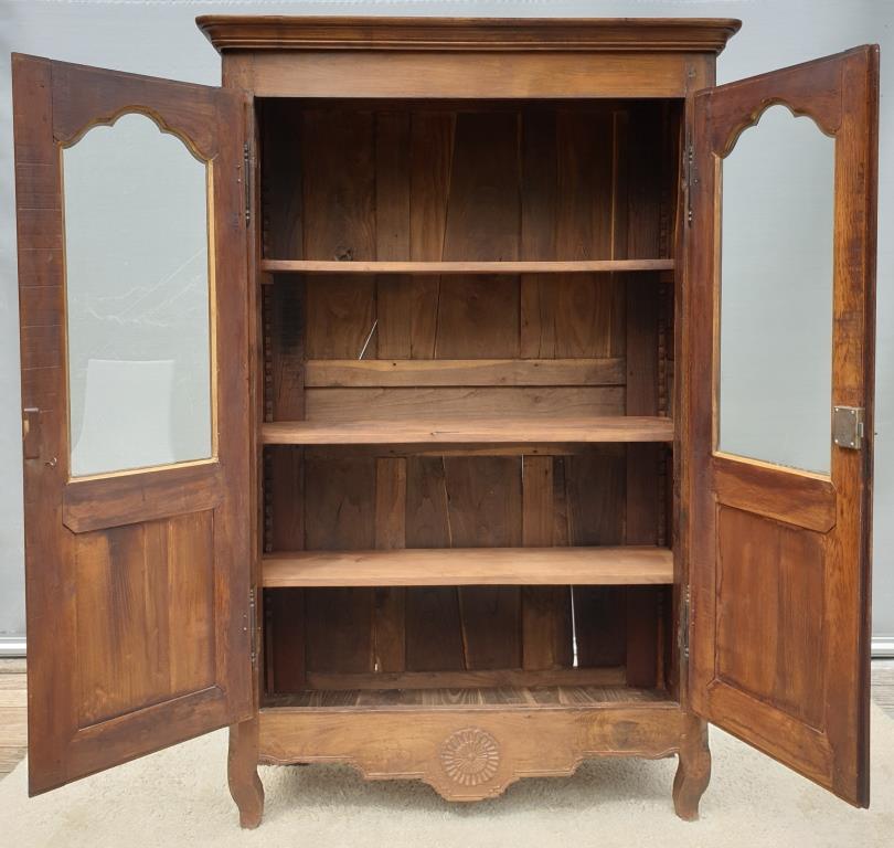 Walnut glazed bookcase with nineteenth century rose window