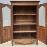 Walnut glazed bookcase with nineteenth century rose window