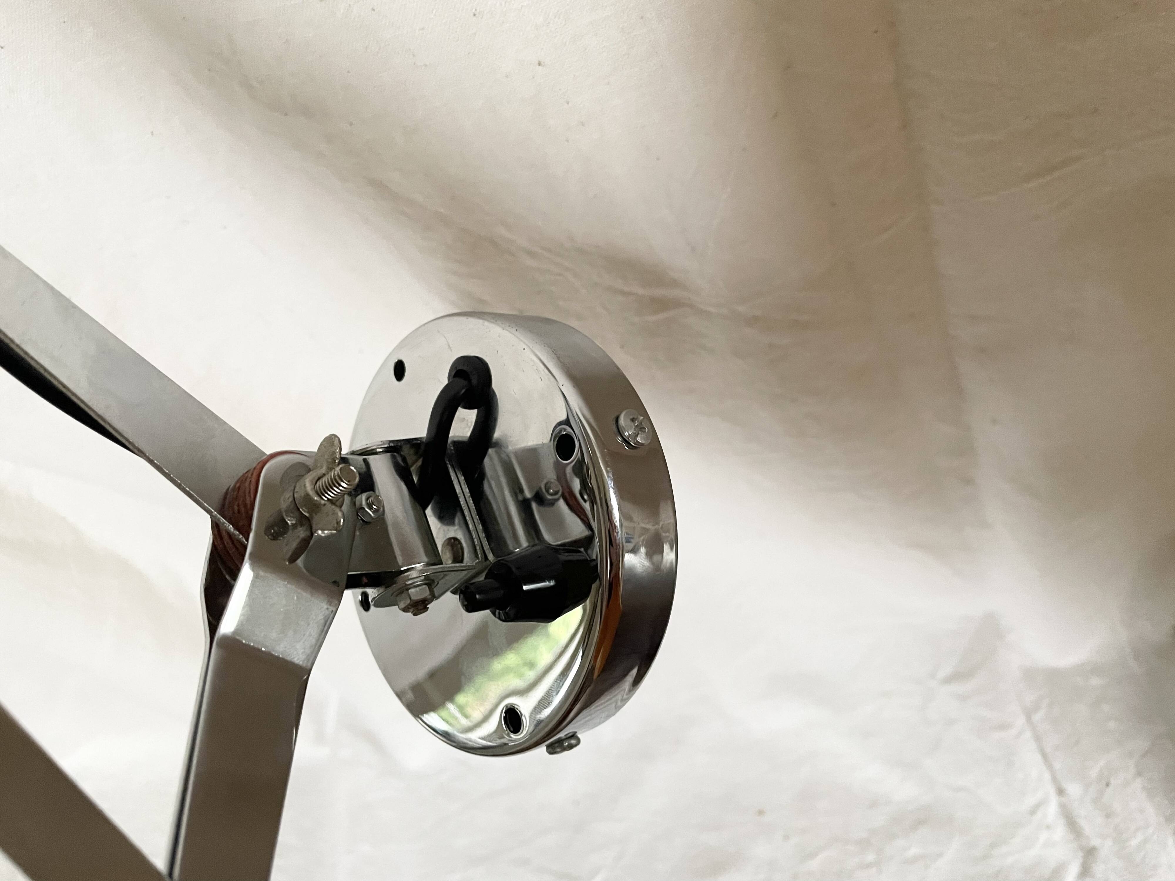 Vintage accordion wall light in chrome metal.