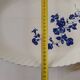 Keller and Guérin Lunéville serving dish with blue flowers on a white background.