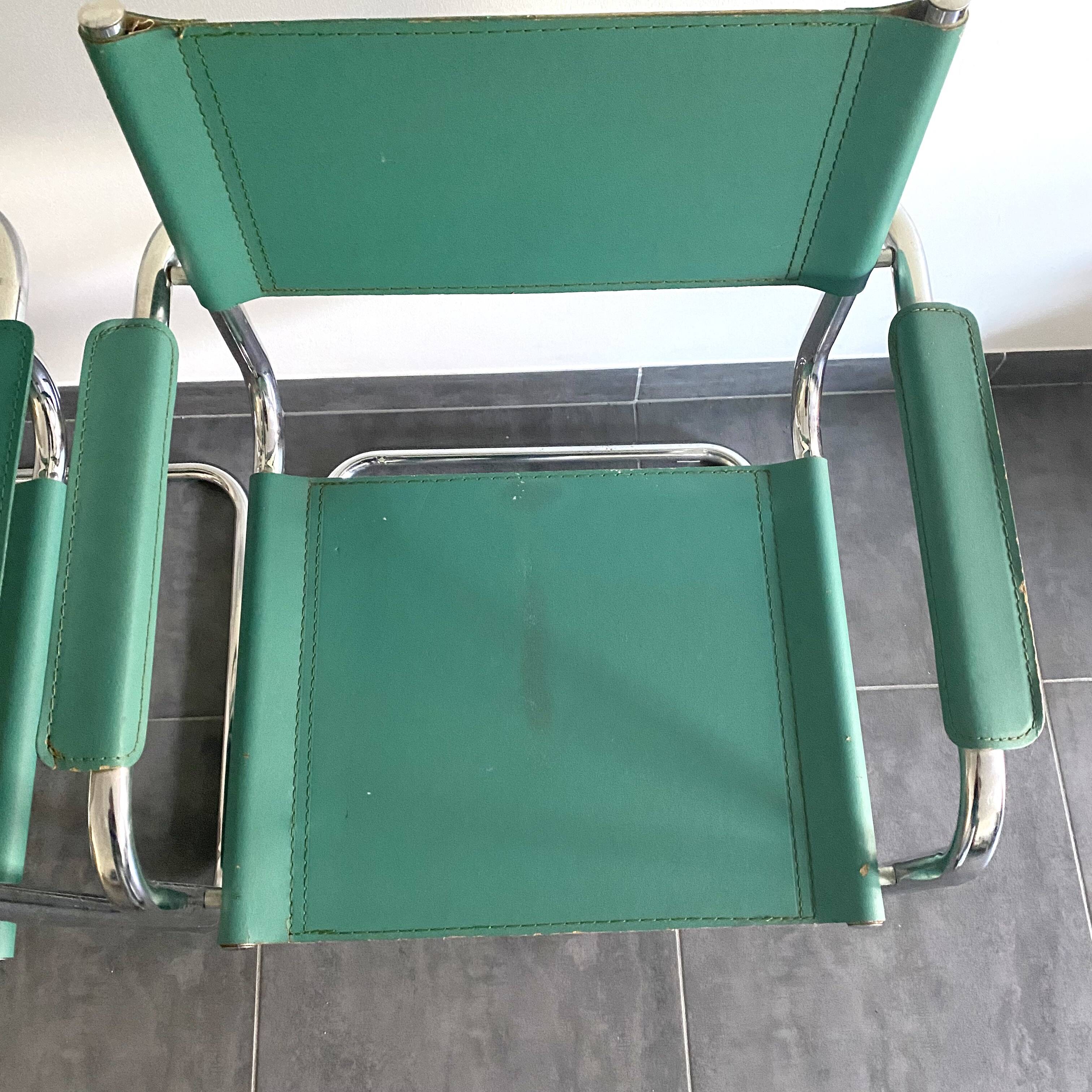 Pair of faux leather and chrome armchairs