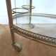 Desserte golden bar brass and glass