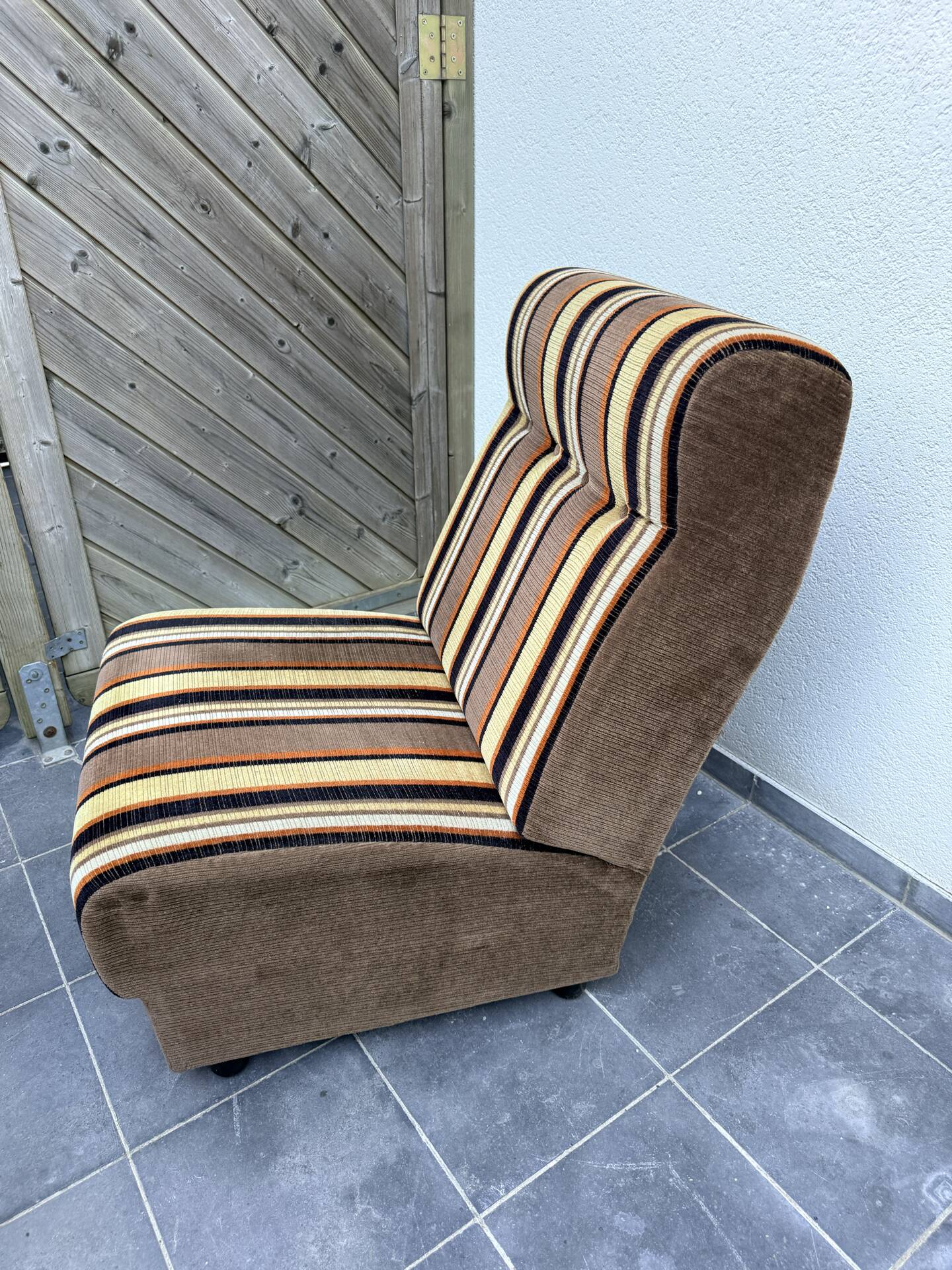 Vintage 1970s lounge chair – striped orange, brown, and cream velvet