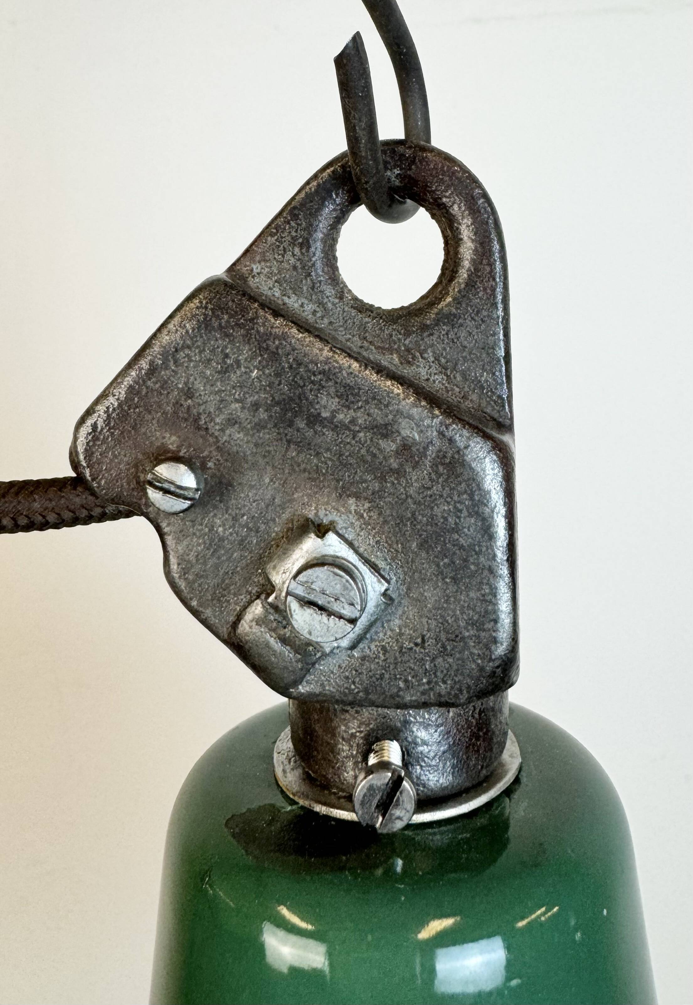 Industrial green enamel factory lamp with cast iron top, 1960s
