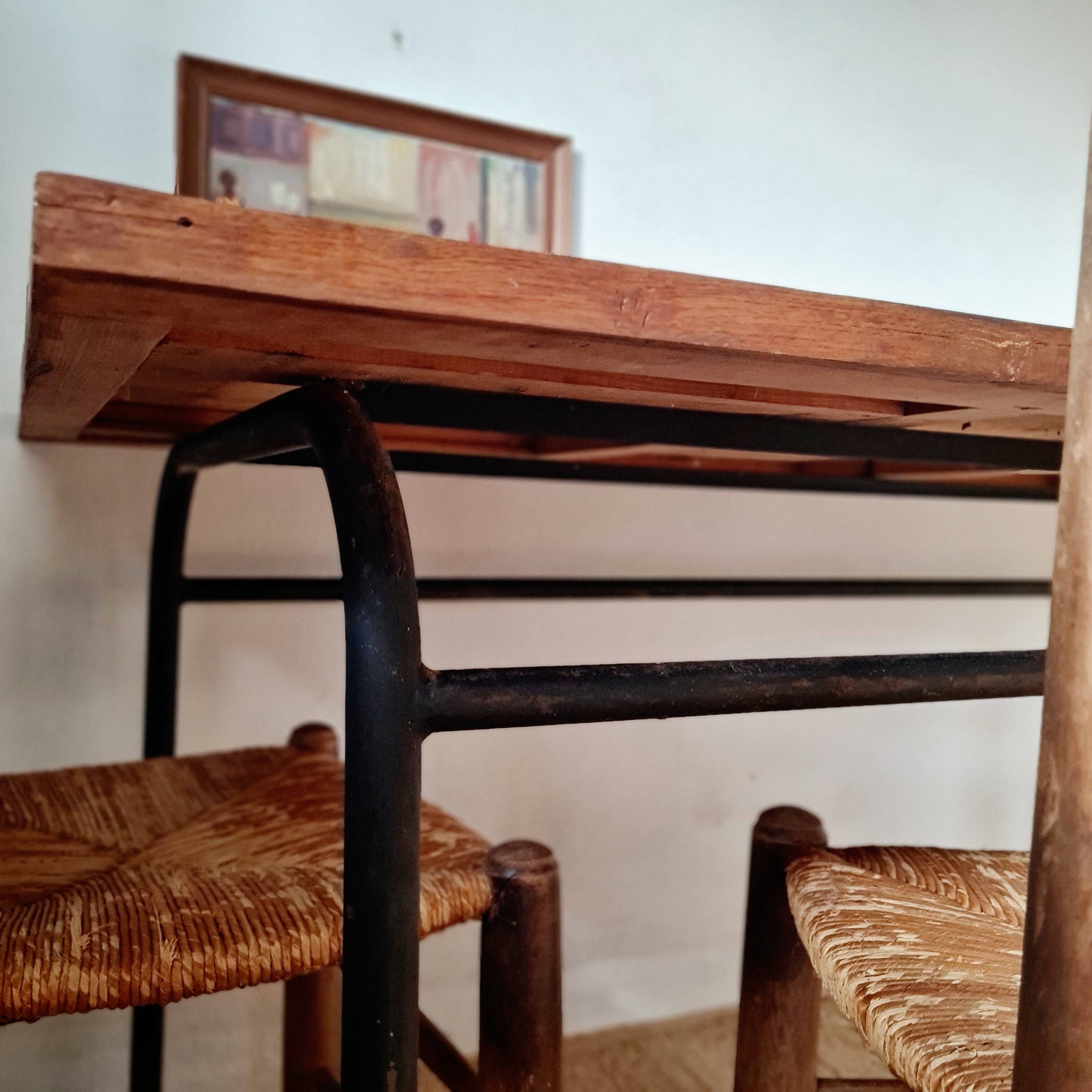 Metal tubular base table with a wooden top.