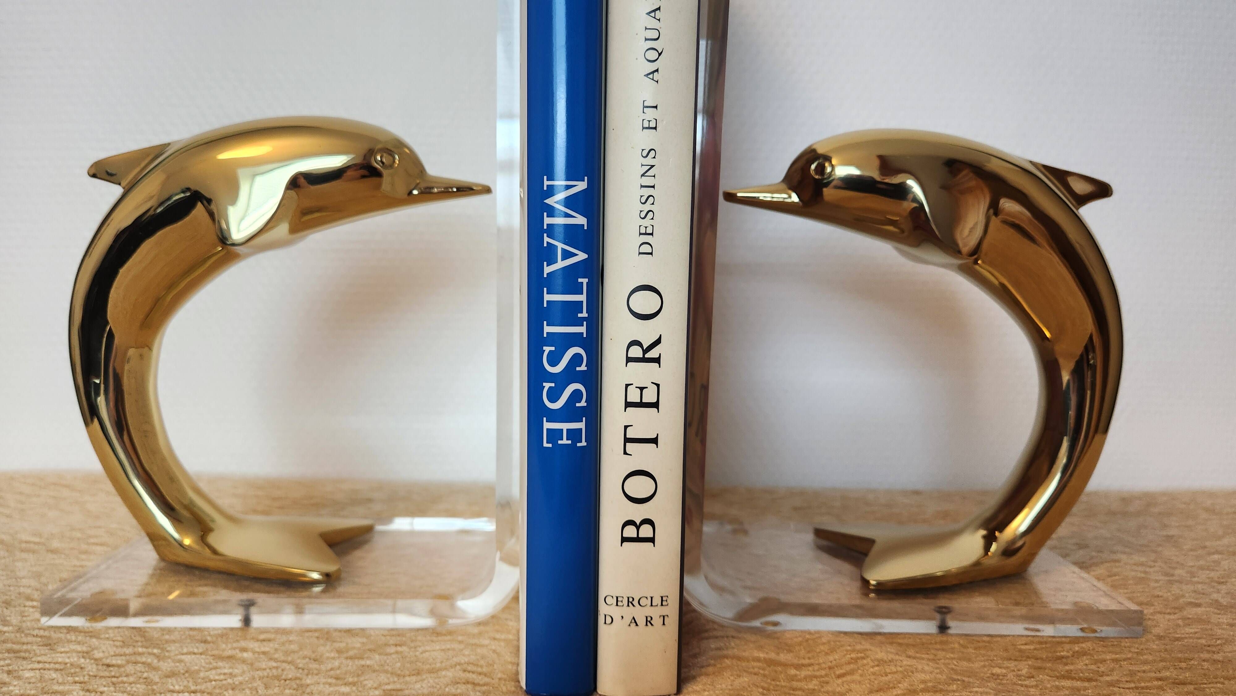 Dolphin bookends in gold metal and plexiglass – 1980s
