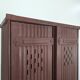 Red painted metal workshop locker with two doors.