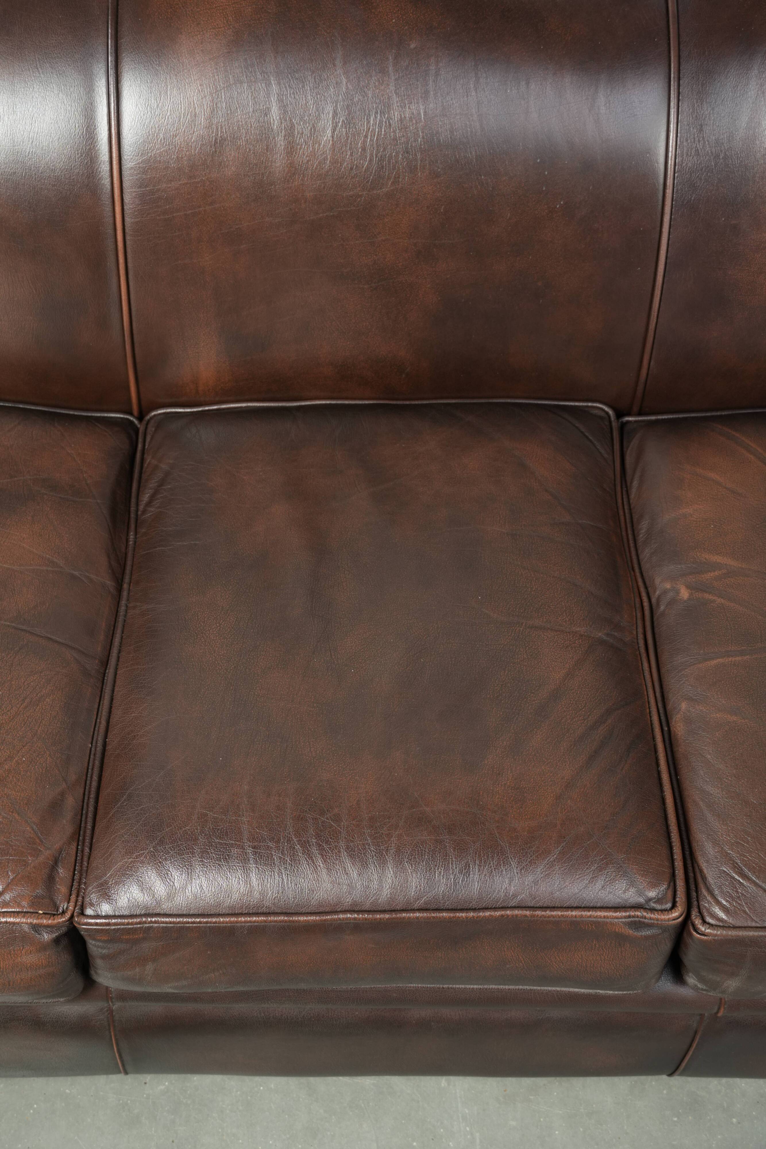 Luxury brown smooth cow leather Chesterfield sofa with an English look