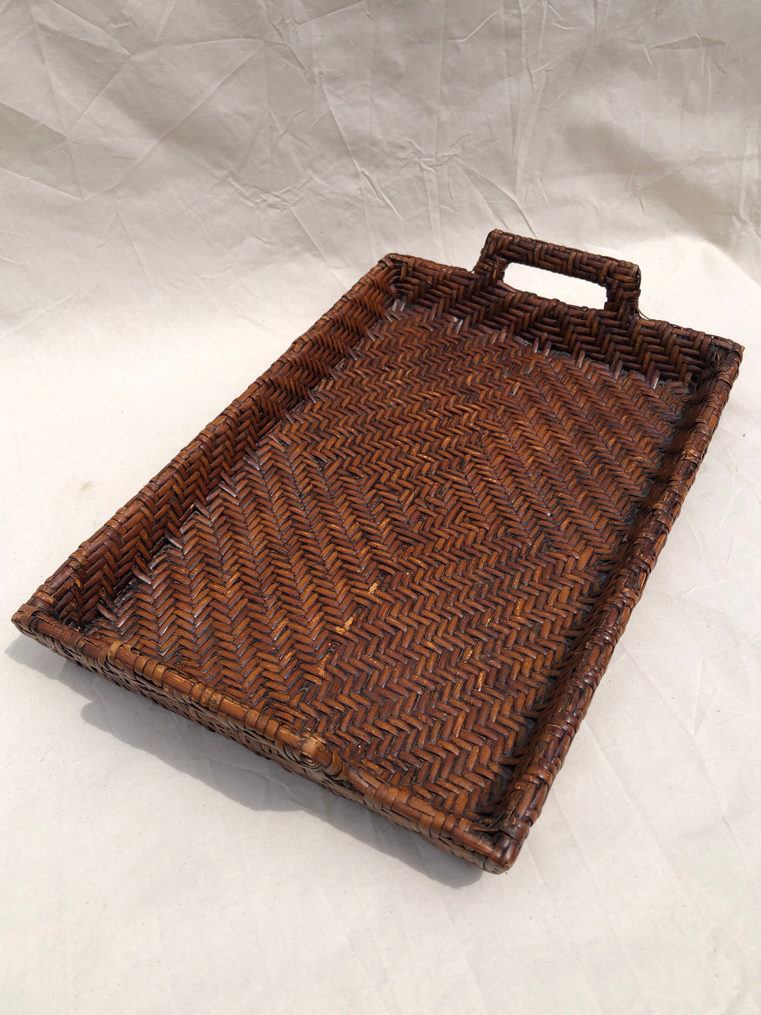 Pair of dark rattan trays