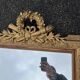 Large gold mirror in Louis XVI style with laurel crown, 121 cm.