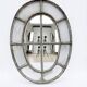 Bull's-eye window from the 19th century in iron (with opening).