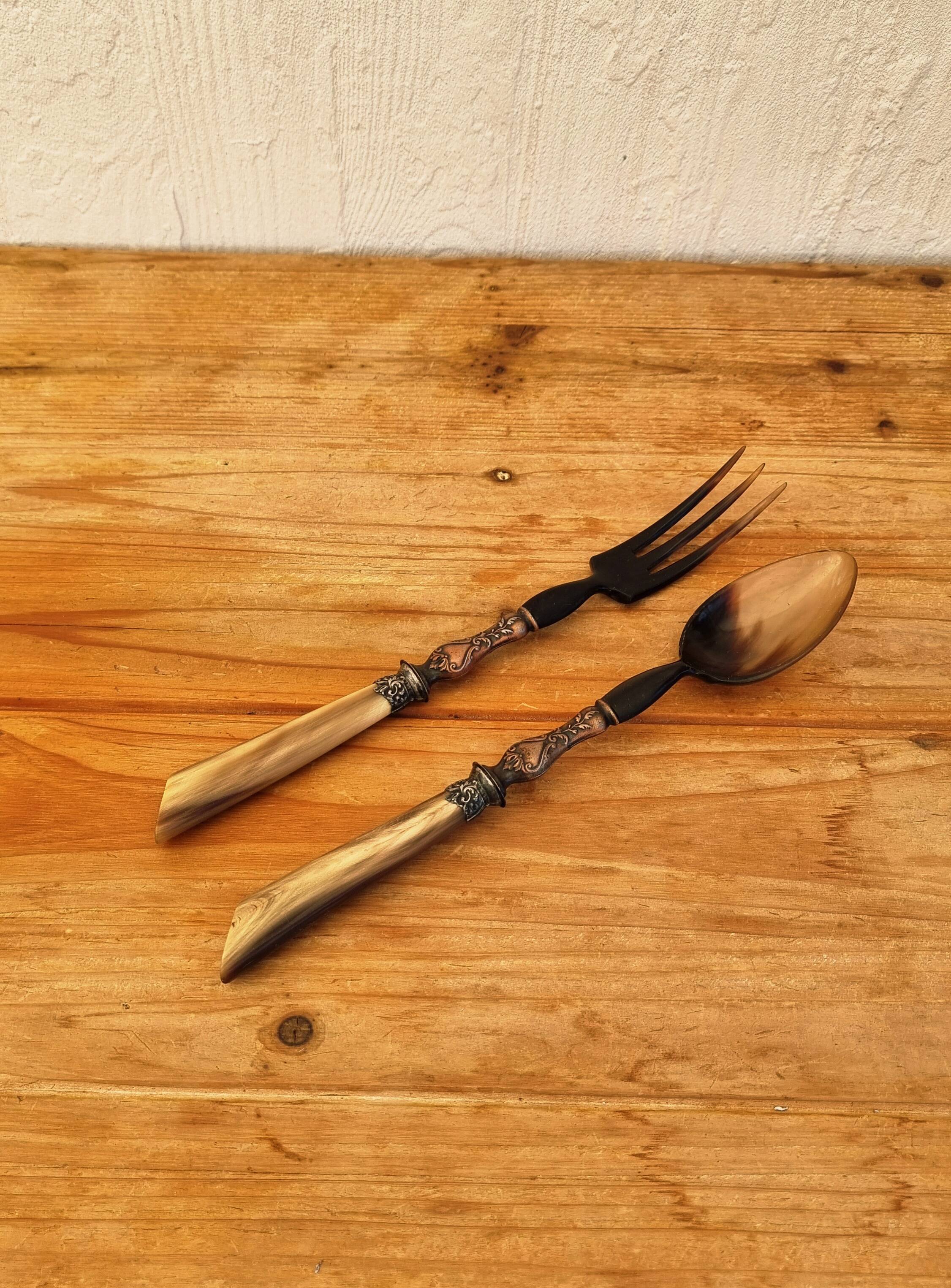 Vintage serving cutlery in horn and wrought metal