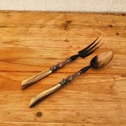 Vintage serving cutlery in horn and wrought metal