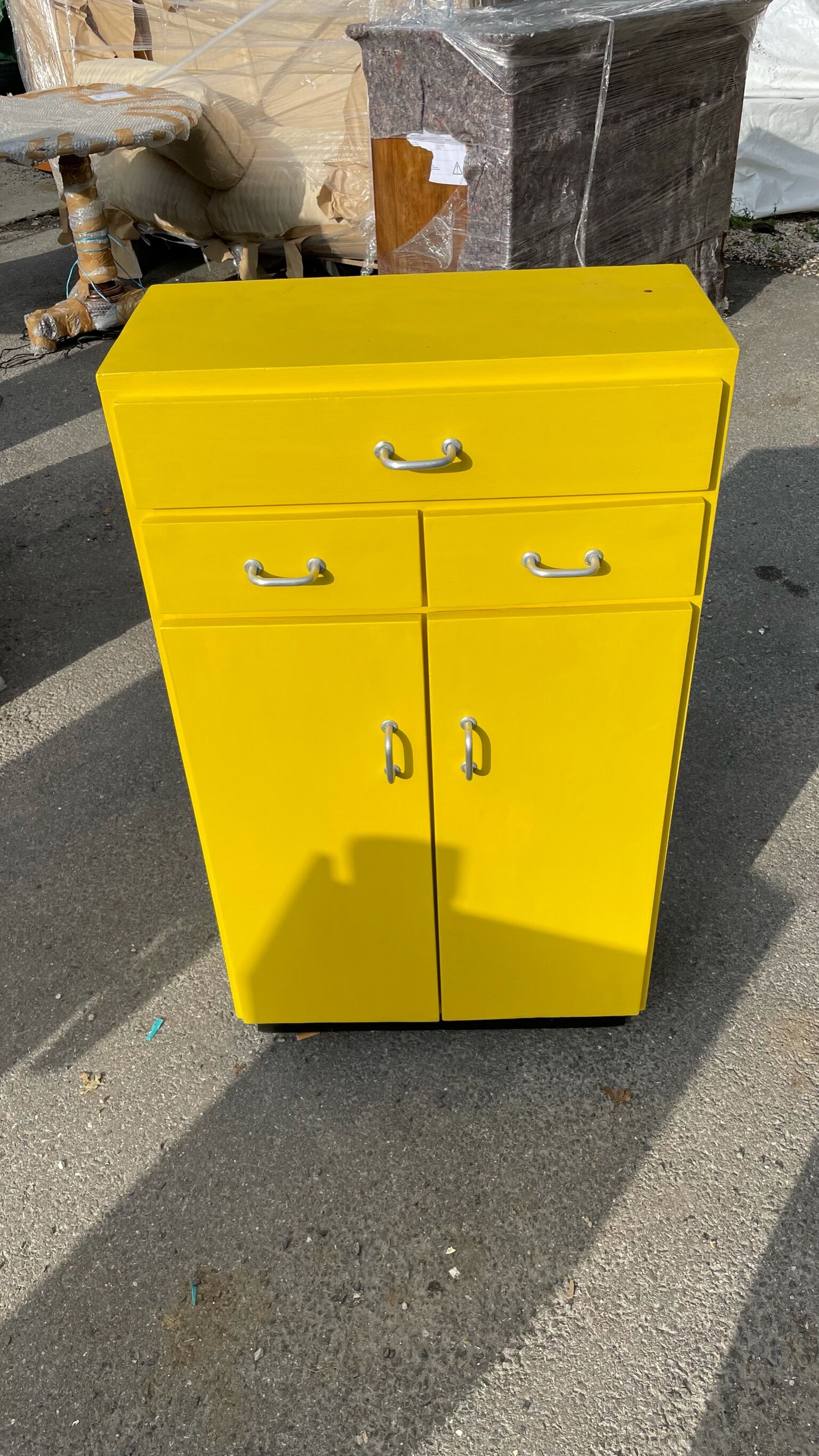 Yellow wooden chest of drawers