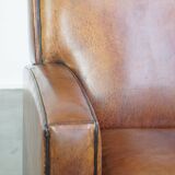 Art Deco design sheepskin leather armchair with a stunning patina