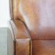 Art Deco design sheepskin leather armchair with a stunning patina