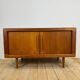 Dyrlund buffet in teak with sliding doors and interior drawers, Denmark 1960.