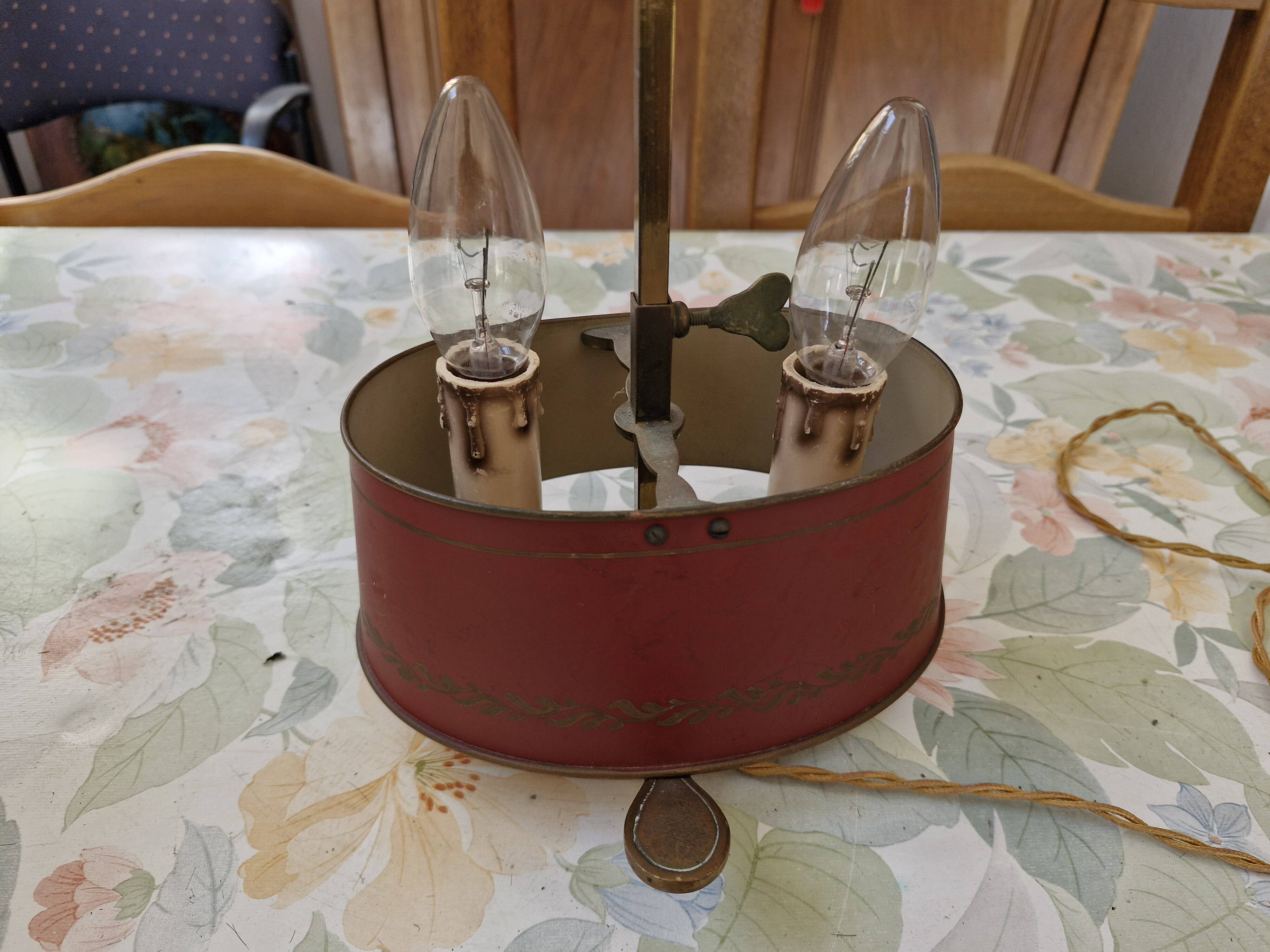 Old silver-plated bronze lamp, except for the arms which are not silver.