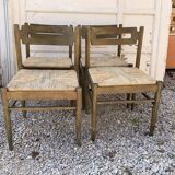 Set of 4 brown wooden dining chairs with straw seats, 1970s.