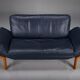 Danish teak and navy blue leather 2-seater sofa from Komfort, 1970s