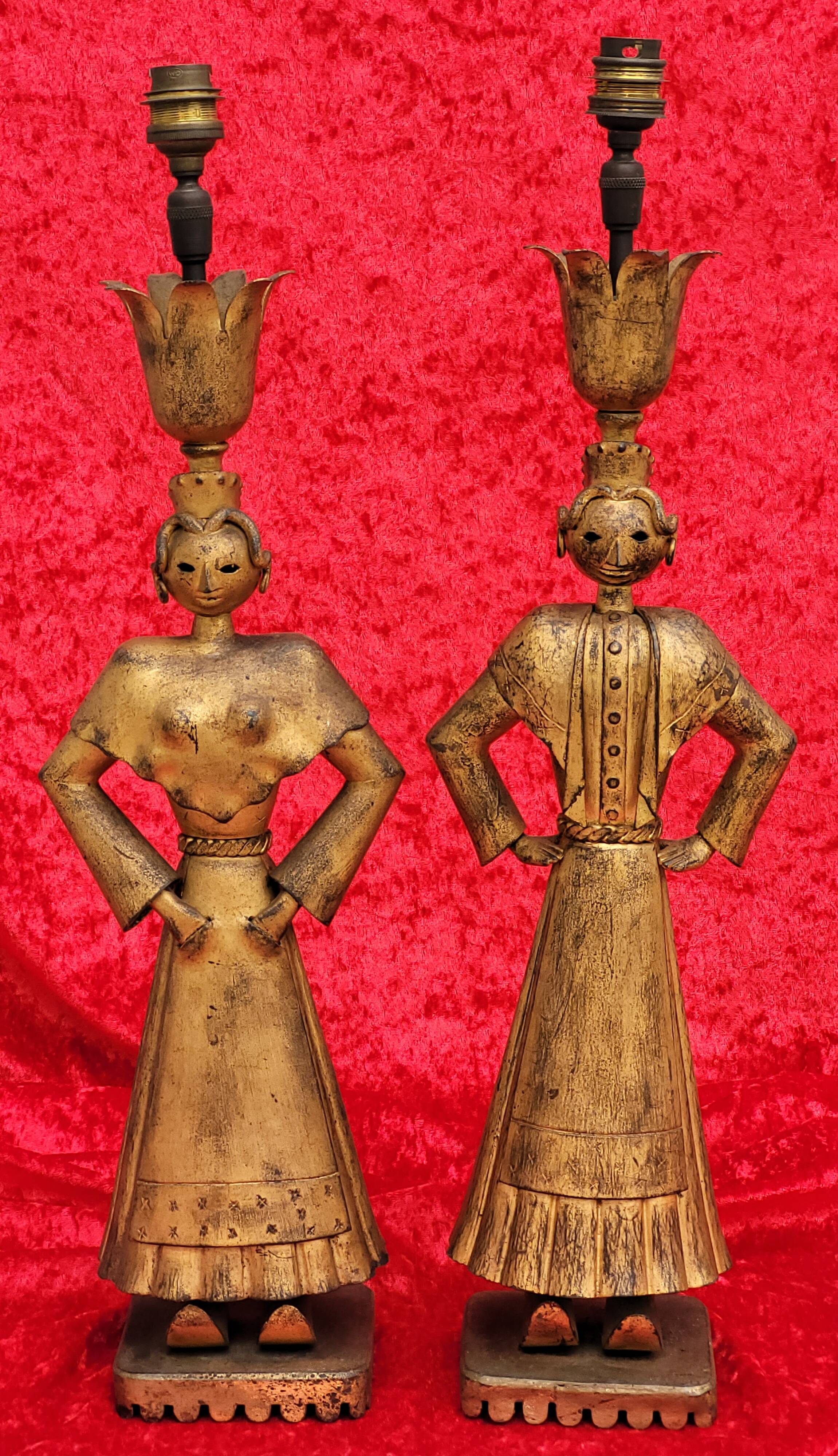 Pair of gilded beaten iron sculpture lamps attributed to Gilbert Poillerat