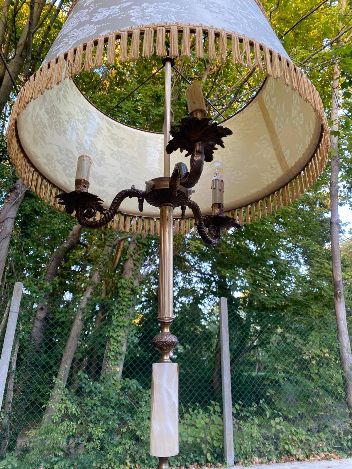 Vintage brass onyx floor lamp with fringed shade.